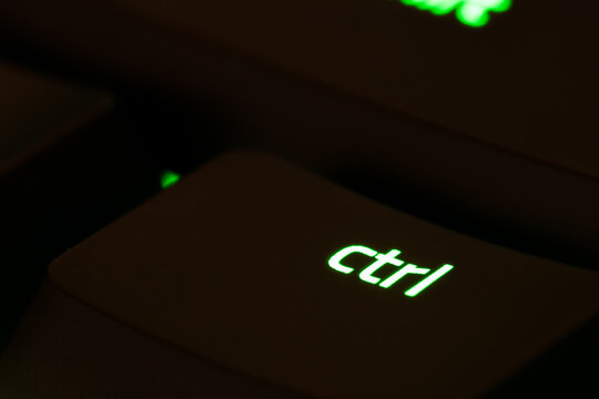 Green illuminated keyboard ctrl control key closeup