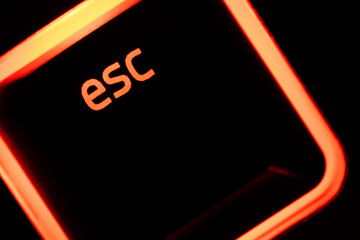 Escape illuminated keyboard esc escape key closeup