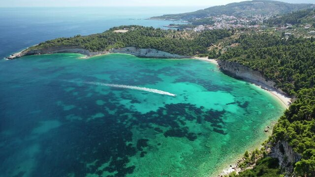 Aerial drone video of secluded paradise beach and bay of Spartines with crystal clear turquoise sea, Alonissos island, Sporades, Greece 