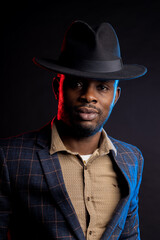 African american business man in black hat in studio