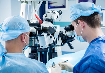 A team of surgeons performing brain surgery to remove a tumor.
