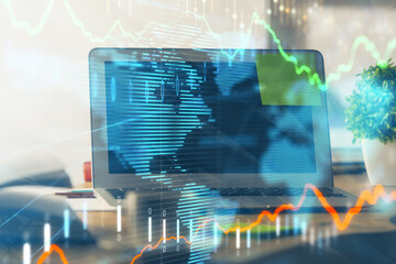 Stock market graph and table with computer background. Double exposure. Concept of financial analysis.