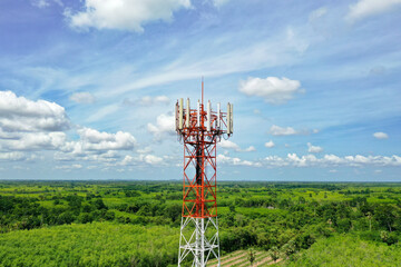 mobile telecommunication cell tower on Sky and clouds background