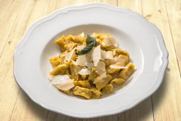 ravioli del plin typical Piedmontese filled pasta from the Langhe in Italy seasoned with butter and...