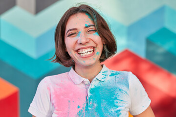 Laughing woman with paint on face