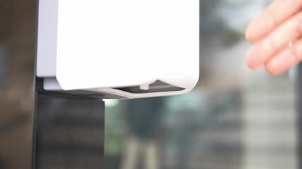 using automatic alcohol gel dispenser,spraying on hands,clean hands,woman in a disinfection tunnel,keeping distance,screening point for COVID-19,new normal under Coronavirus
- Powered by Adobe