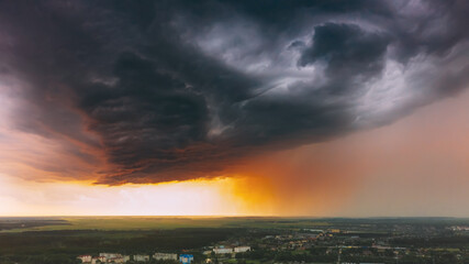 Stormy Sunset Sky Before Rain Above Skyline. Dramatic Cloudy Sky And Flash Light
