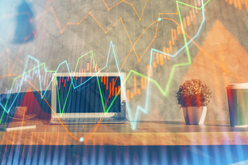 Multi exposure of chart and financial info and work space with computer background. Concept of...