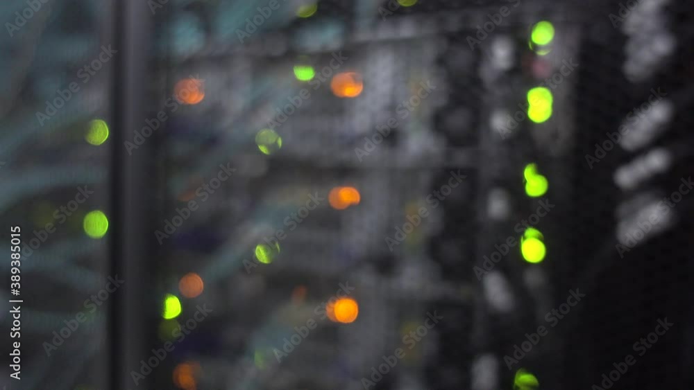 Poster beautiful bokeh. server rack with flashing lights. video contains noise
