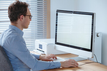 business man working on computer with empty blank screen in the office
