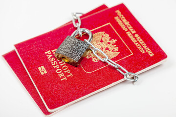 Russian passport with a lock closed on a white background