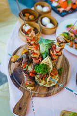 Meat barbecue on skewer and decorated with various vegetables