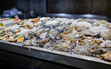fresh green mussel, prawns and crab in seafood on ice buffet bar
