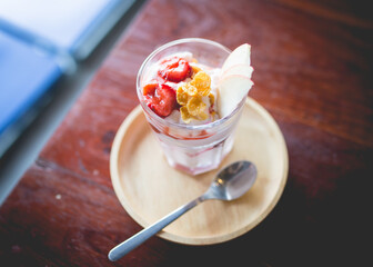 homemade fruit yoghurt with strawberry jam, apple and conflake	
