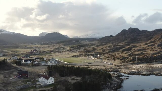 Football pitch in lofoten islands. located in norway, far beyond the arctic circle. Drone video of football tema practice. Located in beautiful area of mountains and see. Living on islands be like