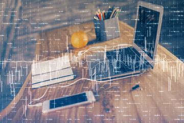Financial graph colorful drawing and table with computer on background. Multi exposure. Concept of international markets.