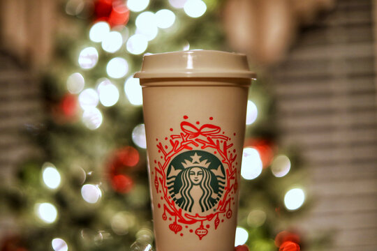Louisville, Kentucky /USA-November 1, 2020: A Starbucks  reusable Christmas seasonal cup with bokeh lights in the background