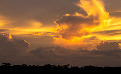 Gorgeous dramatic strong sunset yellow and dark blue evening sky