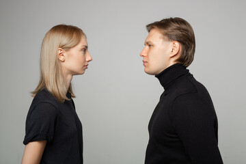 young beautiful couple man and woman in a quarrel
