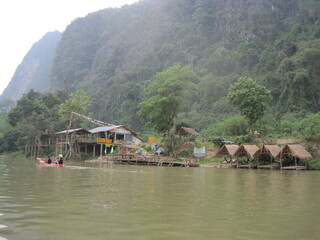 Obraz premium Traveling down the Mekong River and through the jungle landscapes of Laos in Southeast Asia
