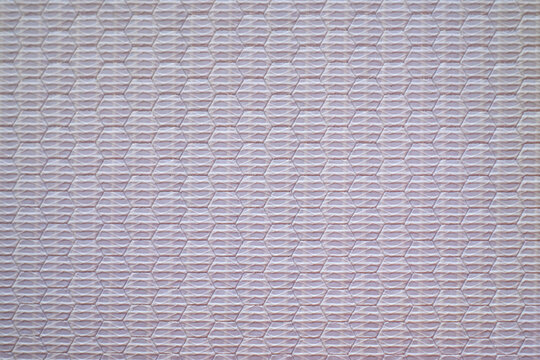 The texture of the banner fabric with a white retroreflective coating.