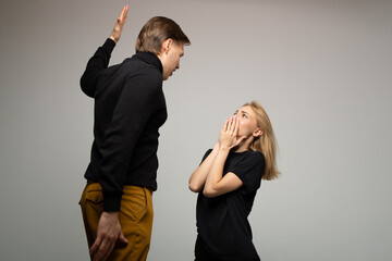 young woman in fear of being hit by a man