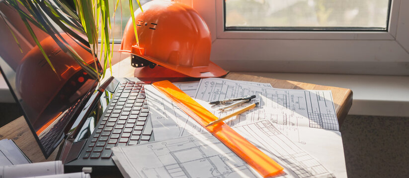 architect design working drawing sketch plans blueprints and making architectural construction model in home..