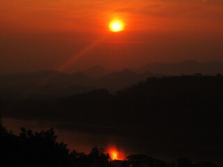 Backpacking down the Mekong river and the jungle landscapes of Laos in Southeast Asia