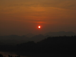 Backpacking down the Mekong river and the jungle landscapes of Laos in Southeast Asia