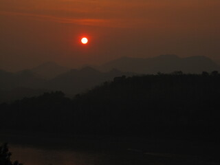 Backpacking down the Mekong river and the jungle landscapes of Laos in Southeast Asia