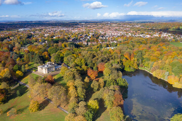 Fototapeta na wymiar A beautiful aerial photo in the autumn fall at the park in Leeds West Yorkshire known as Roundhay Park showing the brown and green colours on the trees