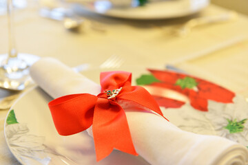 christmas table setting with ribbon. christmas time