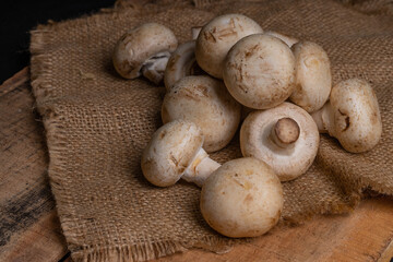 Fresh Button Mushroom on wooden table.