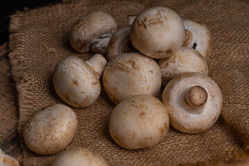 Fresh Button Mushroom on wooden table.