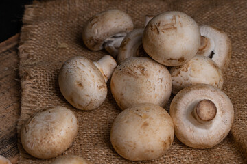 Fresh Button Mushroom on wooden table.