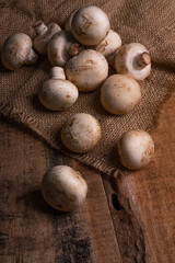 Fresh Button Mushroom on wooden table.