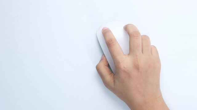 top view of women hand using computer mouse on white background 