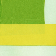 Fototapeta premium Green torn paper collage close-up. Texture made from various paper and cardboard parts. Damaged old paper background. Vintage blank wallpaper. Material design backdrop.