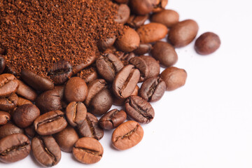 Coffee beans and coffee powder (ground coffee) white background.