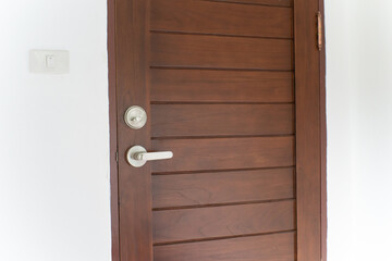 Wooden teak door in modern white room