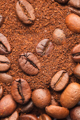 Coffee beans and coffee powder (ground coffee) brown background.