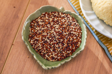 Close-up of quinoa in green leaf shape porcelain dish