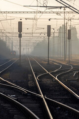 Fototapeta na wymiar medium-sized railway station in the morning fog, Czech Republic