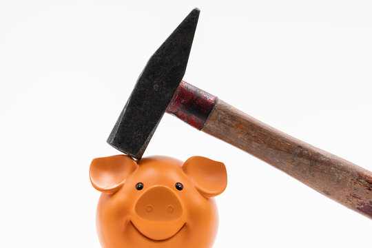 Sparschwein mit Hammer