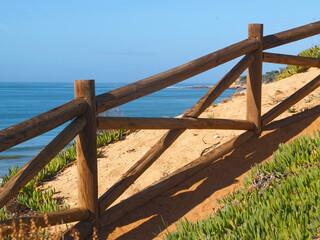Fototapeta premium Hinking at the beach of Praia Maria Luisa, Olhos da Agua, Albufeira, at the Algarve coast of Portugal