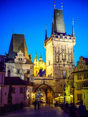 Obraz na płótnie Canvas Charles Bridge towers on the Lesser Town side in Prague after the sunset