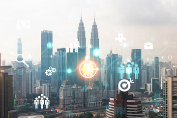 Fototapeta na wymiar Research and development hologram over panorama city view of Kuala Lumpur. KL is hub of new technologies to optimize business in Malaysia, Asia. Concept of exceeding opportunities. Double exposure.