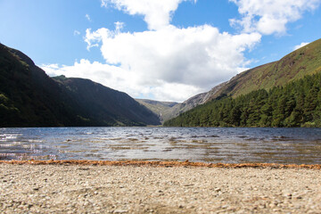 GLENDALOUGH, WICKLOW COUNTY, IRELAND - SEPTEMBER 12, 2018: Glendalough's Upper Lake during a sunny autumn day.