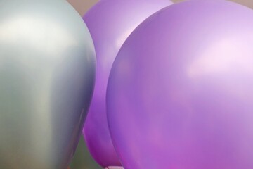 Birthday party. Air balloons used at parties. Birthday celebration. Grey and violet balloon.