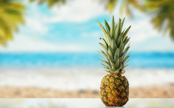 Pineapple on the background of the sea beach